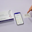 Zenzino Gut Health Test kit with smartphone app showing health analysis results