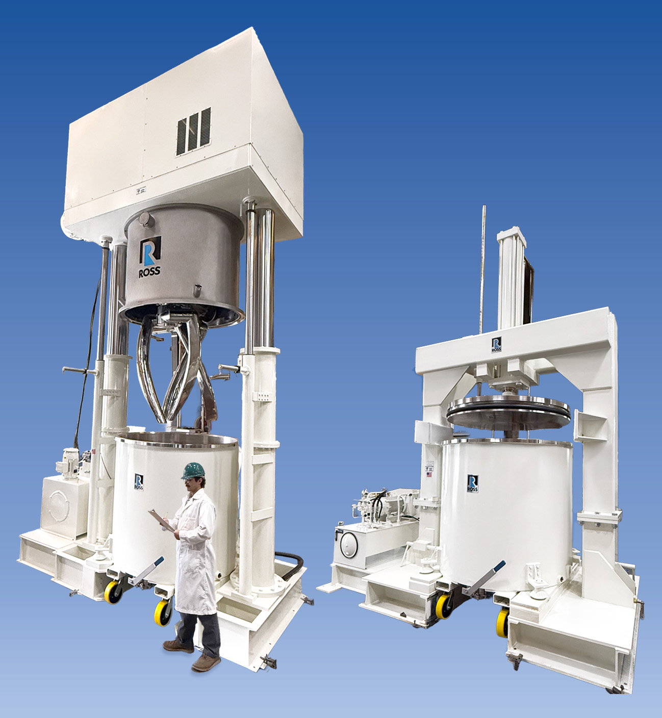Large white industrial mixing machinery with technician in safety gear