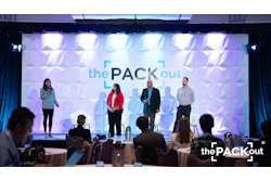 The Pack Out conference stage with four speakers presenting at a professional event