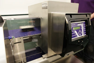 Stealth laboratory equipment with digital control panel and purple-lined compartment