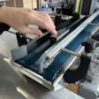 Fernway’s Paxiom dual-head labeler applies regulatory and branding labels to opposite sides of premium cartons at up to 40 per minute.