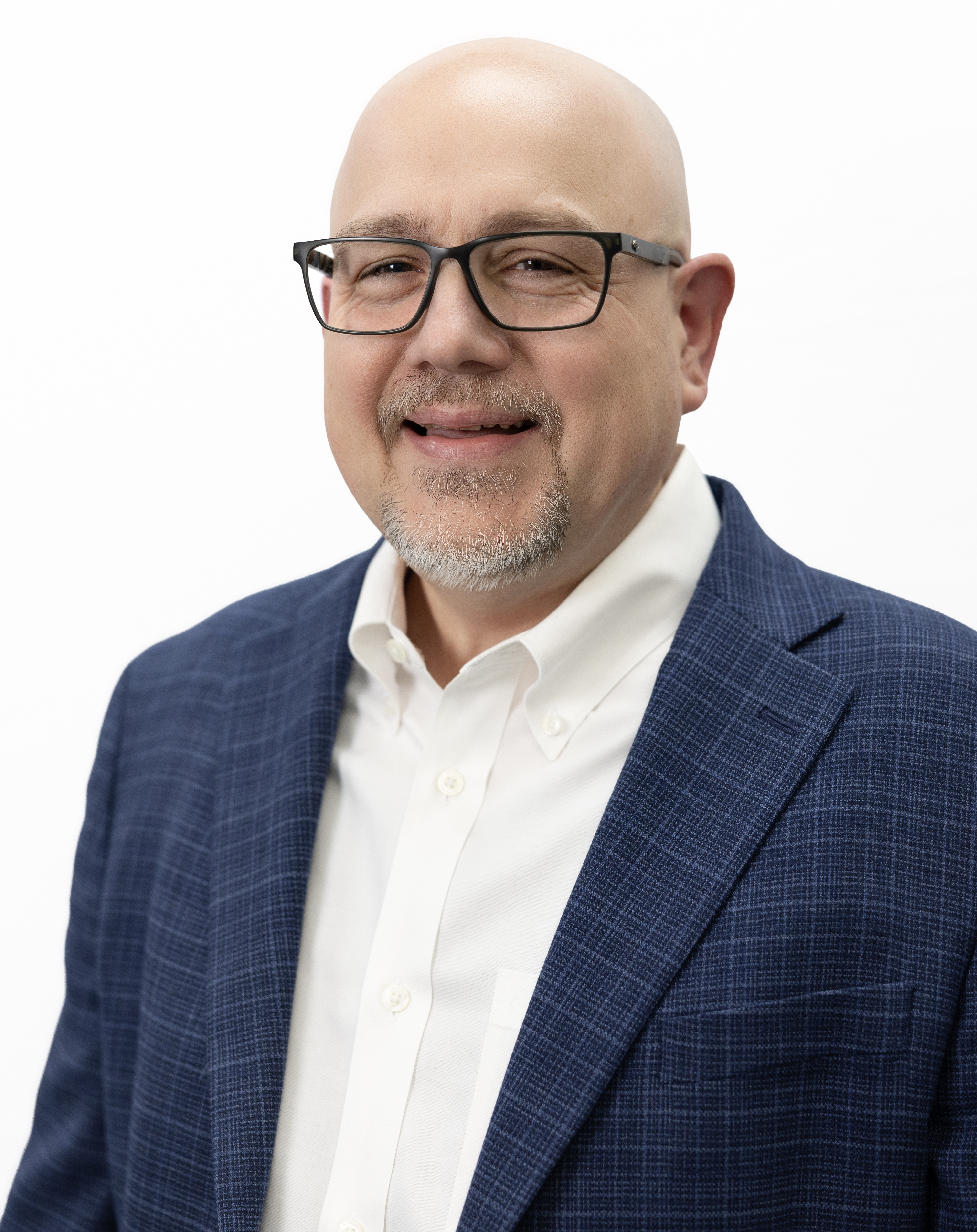 Professional man in blue blazer and white shirt, wearing glasses and smiling