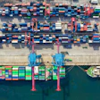 Aerial view of shipping port with colorful cargo containers and container ships