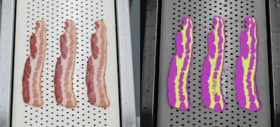 Three raw bacon strips on a metal tray, with color-coded visualization of fat and meat distribution