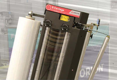S-Carriage industrial equipment with red branding label and metallic cylindrical components