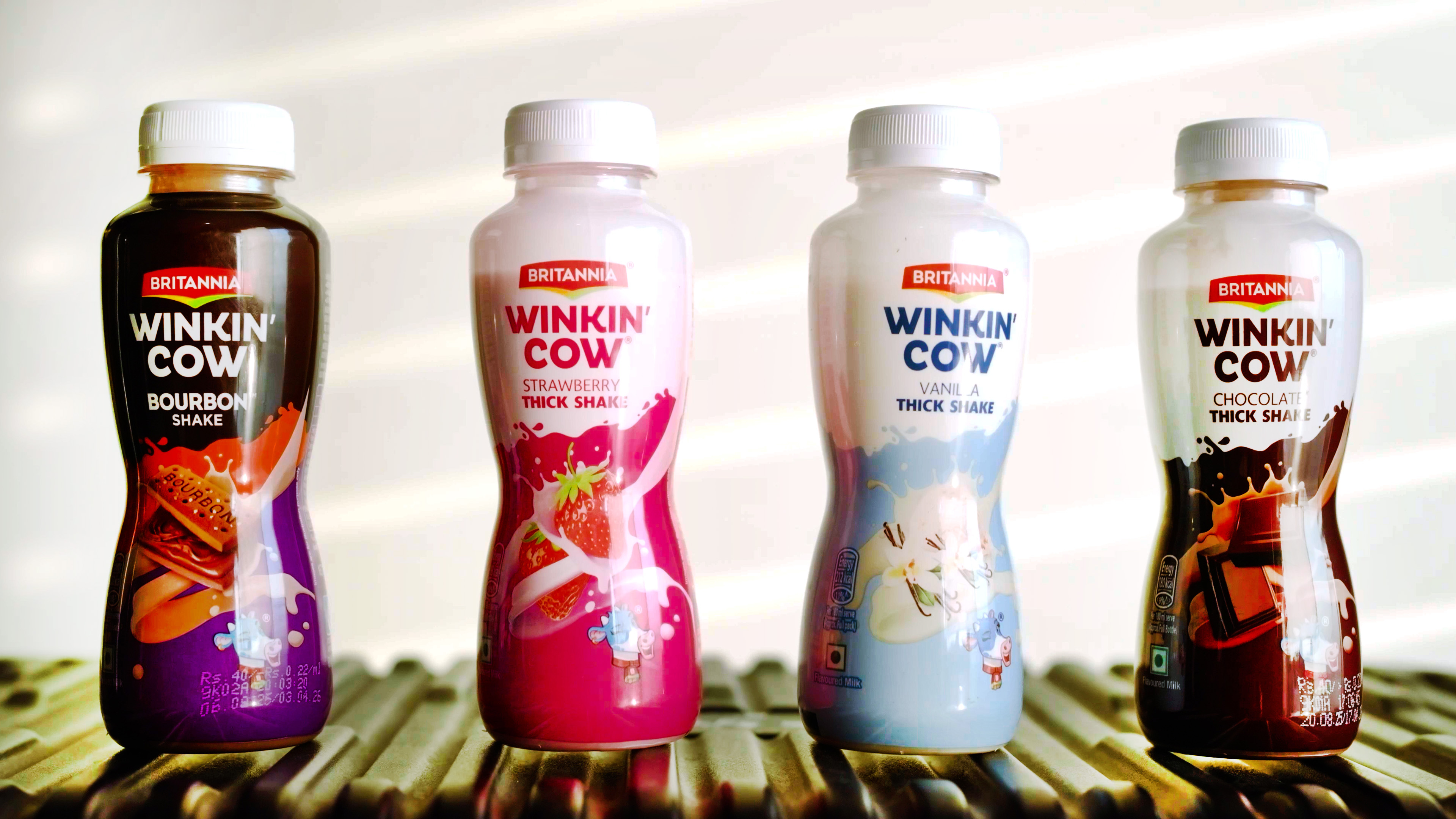 Britannia’s Winkin’ Cow portfolio spans multiple SKUs and flavors, with transparent PET bottles reinforcing product visibility and on-the-go consumption.