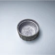 Advanced fiber cap sample approaching plastic-like performance and feel.