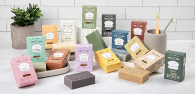 Roots & Leaves packages its bar soaps in recyclable paperboard cartons, using color variations and botanical graphics to differentiate scents.