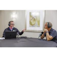 OEM's Sean Riley (left) talks with Mike Rowe.