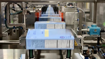 Dry flaked product from a large food brand moves through a horizontal cartoner at GreenSeed.