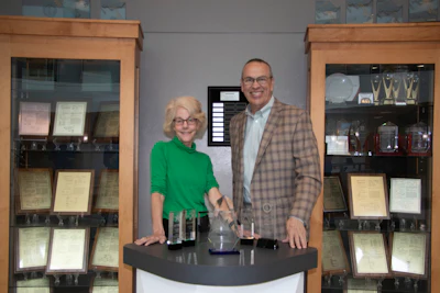 Martha Brooke, Interaction Metrics Founder, presents Dennis Fitzgerald, Yaskawa America VP of Customer Satisfaction, with the 2025 Outstanding CX Award.