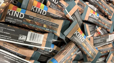 Kind tested a paper wrapper for its Dark Chocolate Nuts & Sea Salt bar to evaluate how the material would perform on existing equipment, withstand distribution, and appeal to consumers accustomed to the brand’s clear plastic packaging.