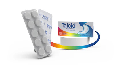 Talcid antacid medication blister pack and product box with rainbow gradient design