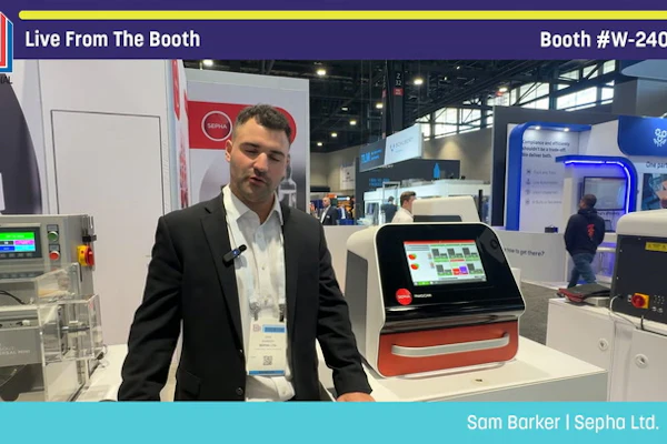 Professional presenting packaging equipment at Pack Expo booth W-24060 trade show