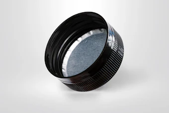 Black camera lens with textured grip ring and blue-tinted glass element on white background