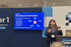 Professional woman presenting at conference with AI diagram on screen behind podium