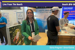 Woman in green blazer at Pack Expo booth W-18110 with team members demonstrating bio-based packaging products