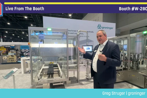 Man in business attire presenting at Groninger booth W-28022 during Pack Expo trade show